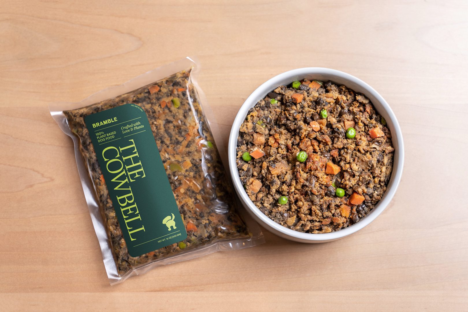 A pack of The Cowbell beside a full bowl of Bramble food